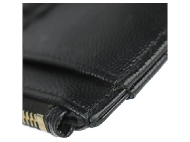 Clutch de cuero negro Saint Laurent 